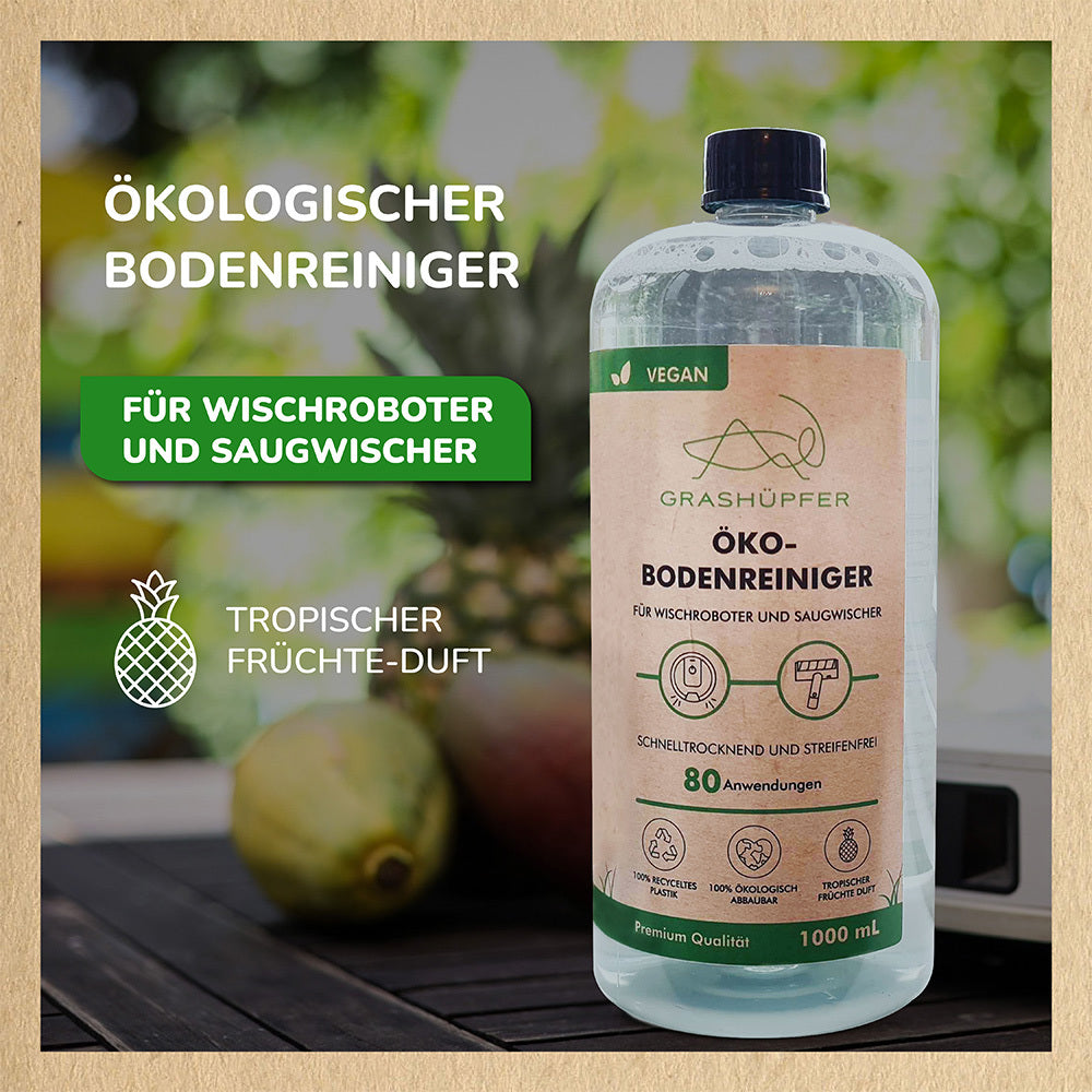Der Öko-Bodenreiniger von Grashüpfer ist zu sehen, der für Wischroboter und Saugwischer geeignet ist, eine Ananas steht für tropischen Duft.