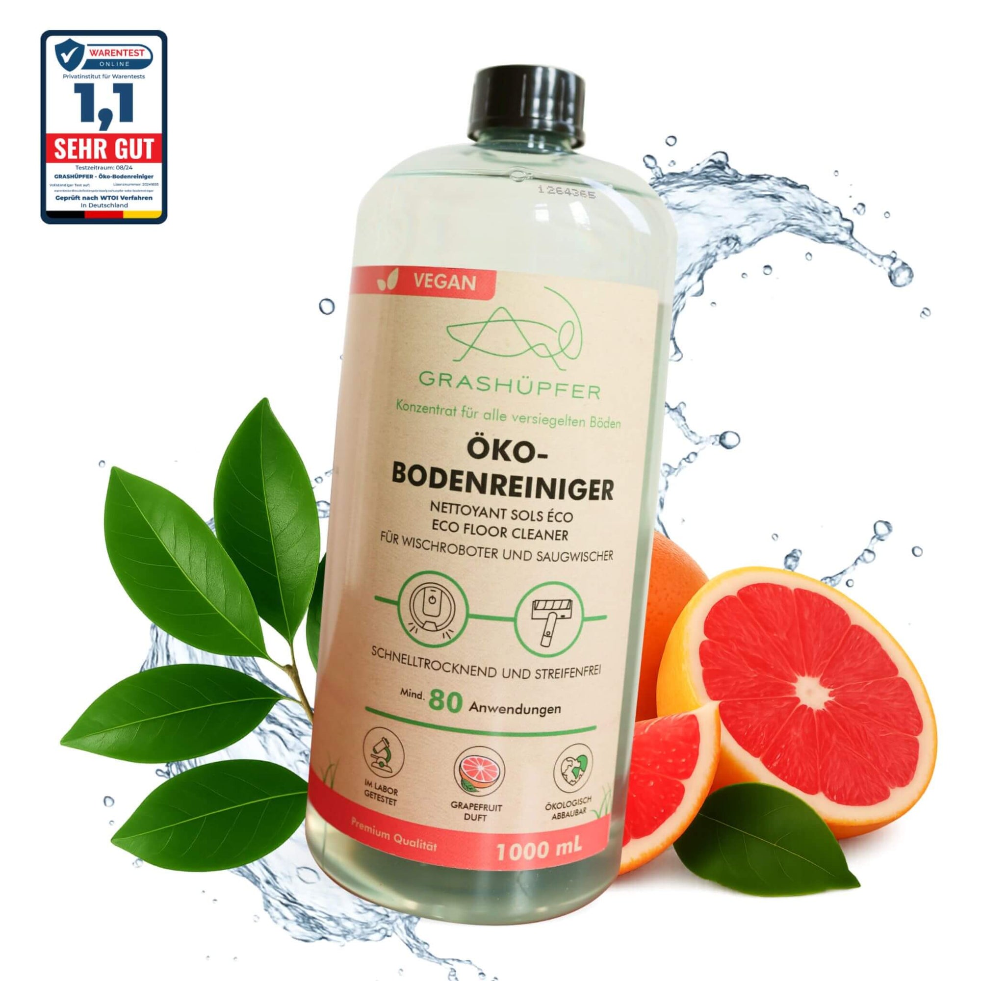Der Grashüpfer Öko-Bodenreiniger steht in der Flasche, daneben liegt eine aufgeschnittene Pink-Grapefruit, welche für einen Pink-Grapefruit - Duft steht.