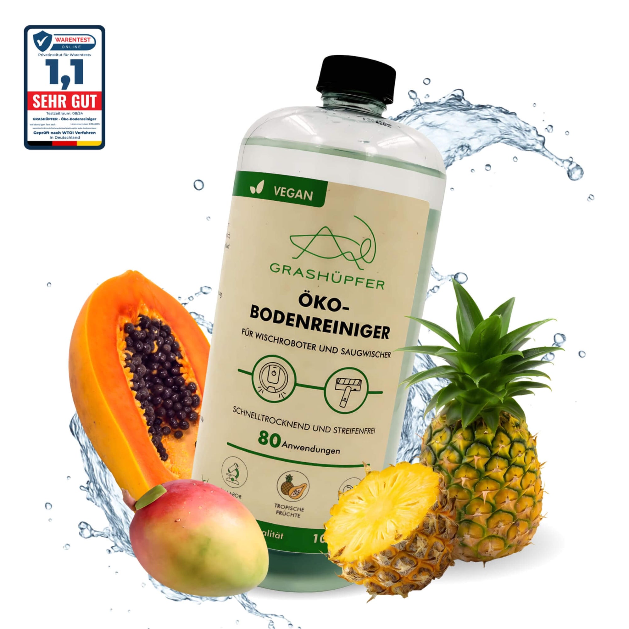 Der Grashüpfer Öko-Bodenreiniger steht in der Flasche, davor liegen tropische Früchte, welche für einen tropischen Früchteduft stehen, dahinter ist ein Saugroboter, weil der Reiniger damit kompatibel ist.