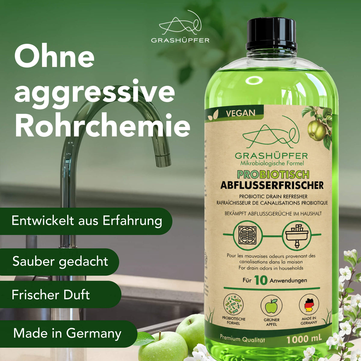 Grashüpfer probiotischer Abflusserfrischer vor einer Küchenspüle; das Produkt wird als Alternative zur Geruchspflege ohne aggressive Rohrchemie dargestellt.